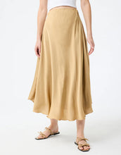 Load image into Gallery viewer, Model wearing Leo &amp; Ugo Malia Satin Skirt in Beige.
