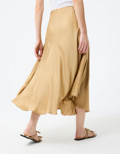 Model wearing Leo & Ugo Malia Satin Skirt in Beige - back.