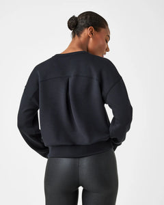 Model wearing Spanx - Air Essentials Crew in black - back.