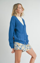 Load image into Gallery viewer, Model wearing Sadie &amp; Sage Eleanor Button Down Cardigan in Electric Blue.
