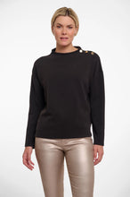 Load image into Gallery viewer, Model wearing Rino &amp; Pelle - Hanne Mock Neck Scuba Top in Black.
