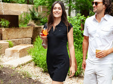 Load image into Gallery viewer, Model wearing Criquet - Women&#39;s Ladybird Polo Dress in Onyx.
