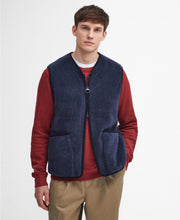 Load image into Gallery viewer, Model wearing Barbour Liddesdale Fleece Vest in Navy.
