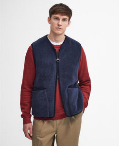 Model wearing Barbour Liddesdale Fleece Vest in Navy.