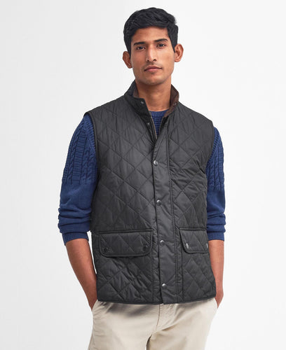 Model wearing Barbour New Lowerdale Quilted Gilet in Black.