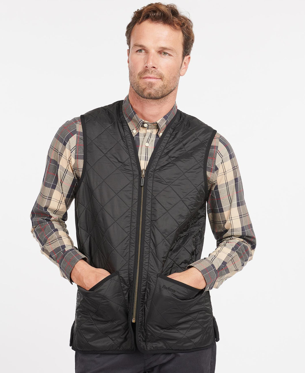 Model wearing Barbour Polarquilt Waistcoat Zip-In Liner in Black.