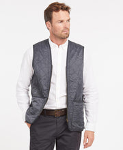 Load image into Gallery viewer, Model wearing Barbour Polarquilt Waistcoat Zip-In Liner in Navy.
