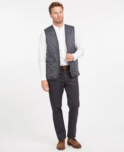 Model wearing Barbour Polarquilt Waistcoat Zip-In Liner in Navy.