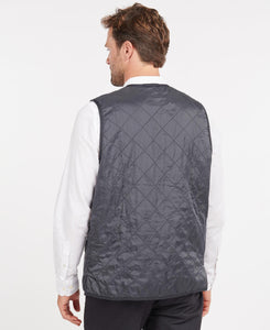 Model wearing Barbour Polarquilt Waistcoat Zip-In Liner in Navy - back.