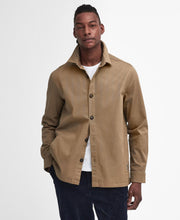 Load image into Gallery viewer, Model wearing Barbour Ruxton Tailored Stretch Twill Overshirt in Stone.
