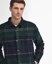 Load image into Gallery viewer, Model wearing Barbour Chapter Tailored Check Overshirt in Green Loch Tartan.
