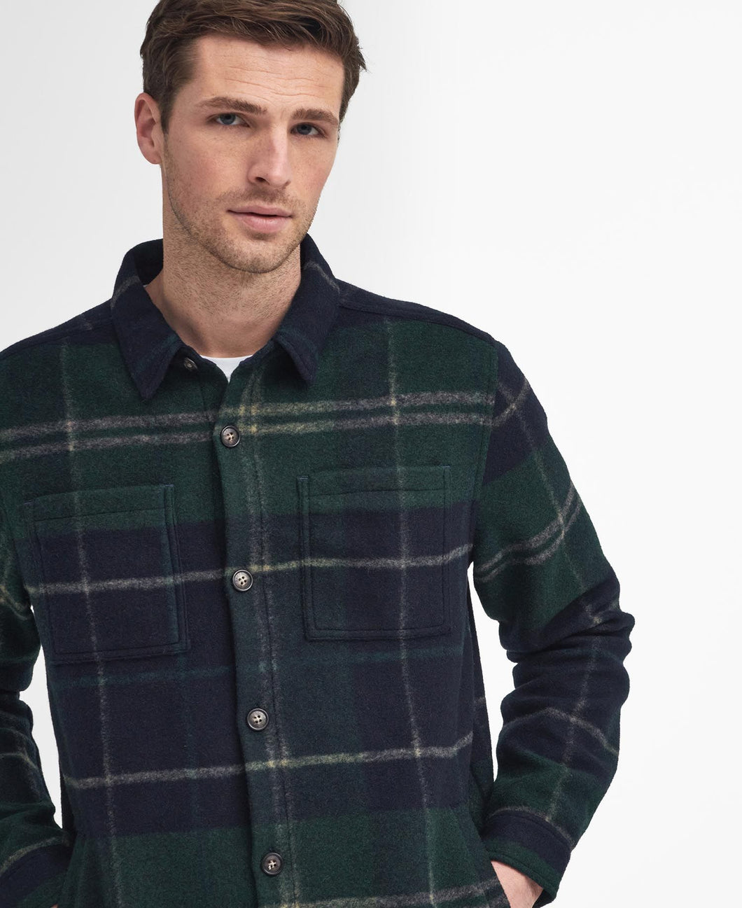 Model wearing Barbour Chapter Tailored Check Overshirt in Green Loch Tartan.