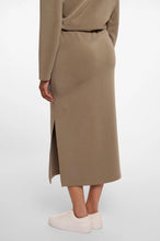 Load image into Gallery viewer, Model wearing Rino &amp; Pelle - Sandy Neoprene/Scuba Skirt in Dark Khaki - back.
