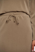 Load image into Gallery viewer, Model wearing Rino &amp; Pelle - Sandy Neoprene/Scuba Skirt in Dark Khaki.
