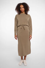 Load image into Gallery viewer, Model wearing Rino &amp; Pelle - Sandy Neoprene/Scuba Skirt in Dark Khaki.
