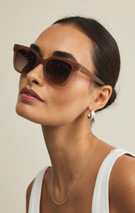 Model wearing ZSupply High Tide Sunglasses in Taupe - Gradient Polarized..