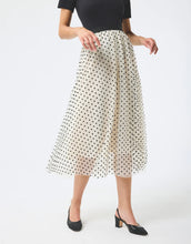 Load image into Gallery viewer, Model wearing Leo &amp; Ugo Etta Tulle Polka Dot Skirt in off white/black.
