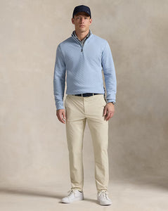 Model wearing  RLX - Ralph Lauren Performance Pant in Sand.