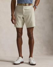 Load image into Gallery viewer, Model wearing RLX - Ralph Lauren 9-Inch Tailored Fit Performance Short in Basic Sand.
