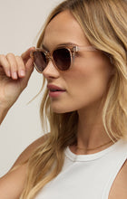 Load image into Gallery viewer, Model wearing ZSupply Shoreline Sunglasses in Sand - Gradient Polarized.
